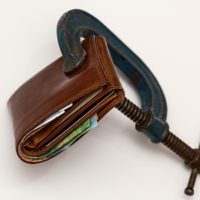 Savvy Spending: 5 Easy Ways to Cut Costs in 2017 credit-squeeze-taxation-purse-tax-46242