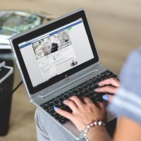 Don’t overshare on social media women-typing-on-the-notebook-Facebook